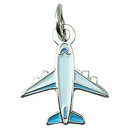 A large, white airplane has been turned into a decorative metal charm.