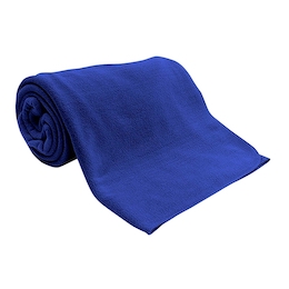 A royal blue fleece blanket is rolled up with just a bit of the blanket unrolled for display.