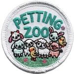 The words Petting Zoo are above a bunch of cute farm animals.