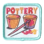 Two cups being painted with pink paint under the word Pottery.