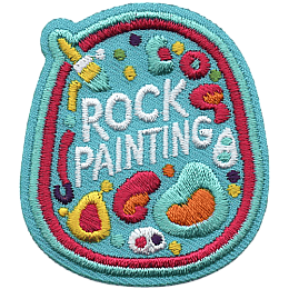 A rock with the words Rock Painting on it and various colourful shapes.