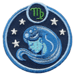 This circular crest has the side profile of a woman, with long flowing hair surrounded by stars. The sign of Virgo sits above her head.