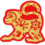 A gold monkey with a red outline and floral details on its body.
