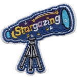 A patch of a telescope with the word Stargazing on the casing.