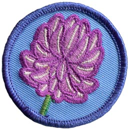A bushy purple clover sits on a green stock on this round, merrow border patch.