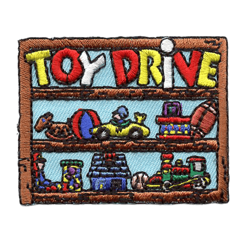 A wood shelf with toys on it. The words Toy Drive are across the top shelf.