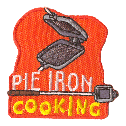 An open Pie Iron with the words Pie Iron Cooking underneath. Another Pie Iron is between the sentence.
