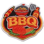 A grill filled with meat and the word BBQ in the middle.