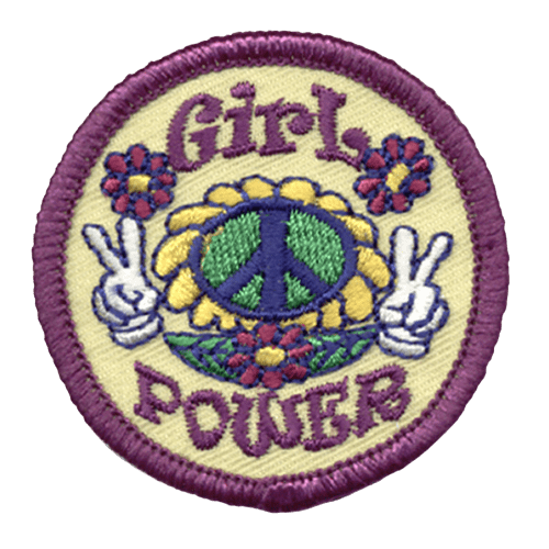 A circular patch with the words Girl Power embroidered around a sunflower with a peace symbol replacing its seeds. Two hands make peace signs on each sides of the flower.