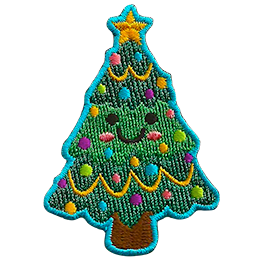 A decorated Christmas tree with a smiling face.