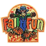 A scarecrow between the words Fall Fun.