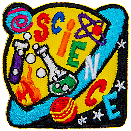 A yellow and blue Saturn with beakers on it. The word Science is stitched across the planet.