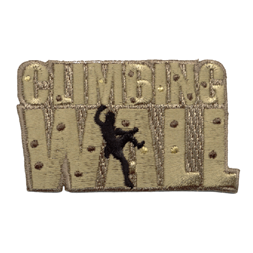 The words Climbing Wall are the background of this patch. The words are dotted with rocks, and a silhouette of a man is climbing the A.