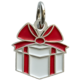 A present with a red ribbon has been turned into a decorative metal charm.