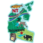 This patch is shaped like the Northwest Territories, decorated with an Arctic Grayling fish, the aurora borealis, a caribou, a mountain avens flower, a buffalo, and Yellowknife.