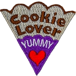 The words Cookie Lover Yummy are on a cookie slice with a red heart and purple icing.