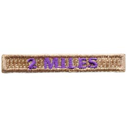 The number 2 Miles are stitched in purple thread on a brown rectangle.