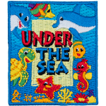 The words Under The Sea are surrounded by smiling sea creatures such as a turtle, a seahorse, two dolphins, a fish and a starfish on an ocean background.