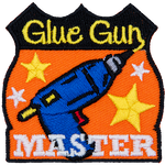 This achievement badge showcases a glue gun surrounded by gold stars.