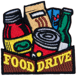 The words Food Drive are on a box holding nonperishables.