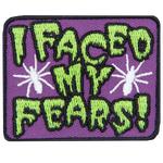 The words I Faced My Fears are in drippy green text with two white spiders on either side.