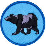 A black bear on a blue background.