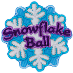 A snowflake with the words Snowflake Ball in purple thread across the middle.
