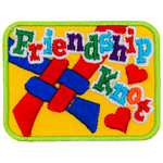 The words Friendship Knot are over the top of a knot made from red and blue string on a yellow background.