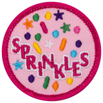 Multicoloured sprinkle shapes fall around the word Sprinkles.
