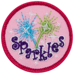 A green and blue sparkler above the word Sparkles.