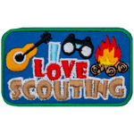 The words I Love Scouting below a guitar, binoculars and campfire.