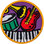A guitar, piano, drum and trumpet on a circle patch.