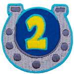 A horseshoe displays the number 2 to symbolize the second-year achievement.
