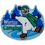 A polar bear skates on a tree-lined pond next to the text Winter Camping.