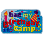 The words I Had My Birthday At Camp are surrounded by confetti, a candle and a party hat.