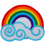 A bright rainbow arcs above a swirling cloud. The colours from the outside of the arc toward the middle are: red, orange, yellow, green, blue, and violet. 