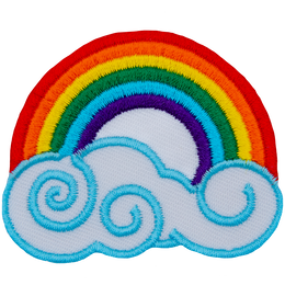 A bright rainbow arcs above a swirling cloud. The colours from the outside of the arc toward the middle are: red, orange, yellow, green, blue, and violet. 