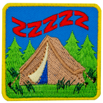 A brown tent in the woods with the letter Z above it a few times to represent sleep.