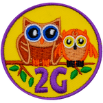 Two owls on a branch above the number and letter 2G.