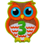 An orange owl with big blue eyes stands at the ready. The number 3 is embroidered in green on the owl's chest.