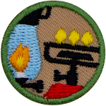 This round one-inch patch depicts a camping lantern and a lit stove.