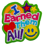 The words I Earned Them All dominate this patch. In the bottom right sits a yellow smiley face, and in the top right are two stars. 