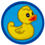 A yellow rubber duck stares vacantly off to the right of this round, merrow border patch.