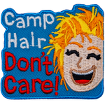 Camp Hair Don't Care is next to someone with messy blonde hair.