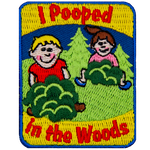 The words I Pooped In The Woods are above and below two figures in bushes.