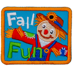 A smiling scarecrow in a red shirt and straw hat is next to the words Fall Fun.