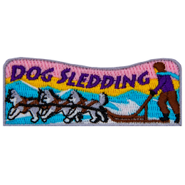 The words Dog Sledding are above a dog sled pulled by three dogs.