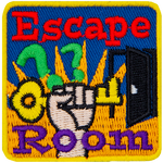 A hand holds a key triumphantly. The words Escape Room are across the top and bottom.