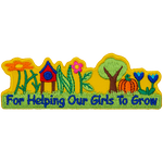 The words Thank You are made from a tree, grass, pumpkins, a birdhouse and flowers.