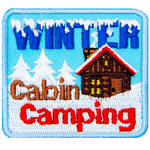 The words Winter Cabin Camping surround a red-roofed cabin in a snowy landscape. 